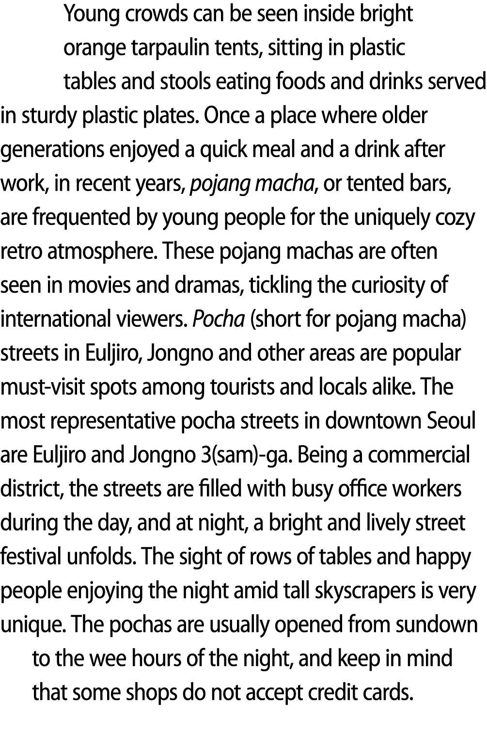Young crowds can be seen inside bright orange tarpaulin tents, sitting in plastic tables and stools eating foods and ...